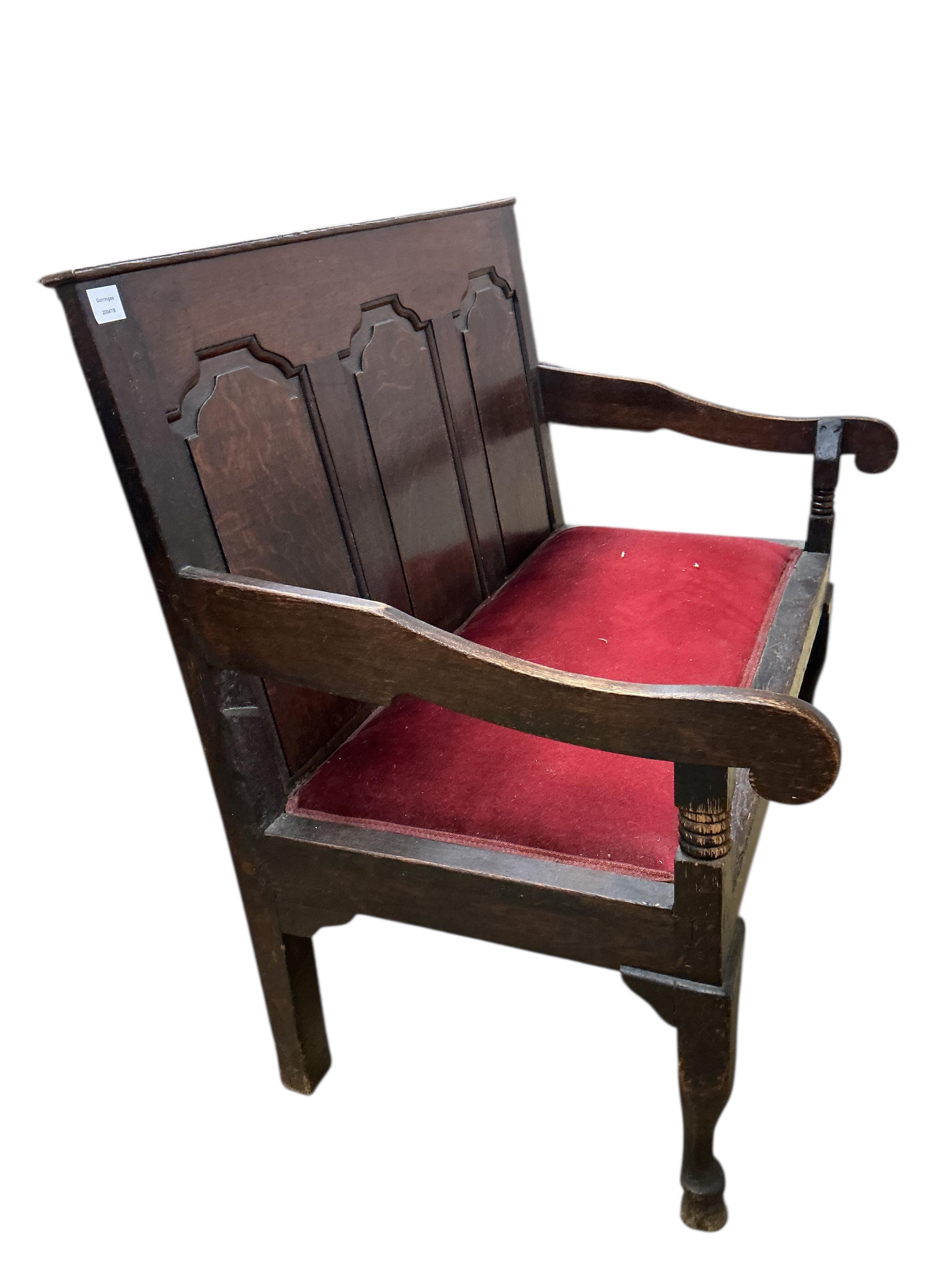 A small George III panelled oak settle, width 112cm, depth 65cm, height 99cm